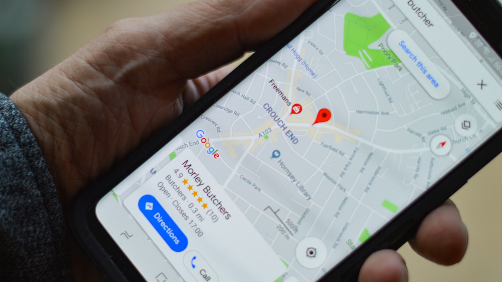 Customer searching Google Maps on a phone for a local service business