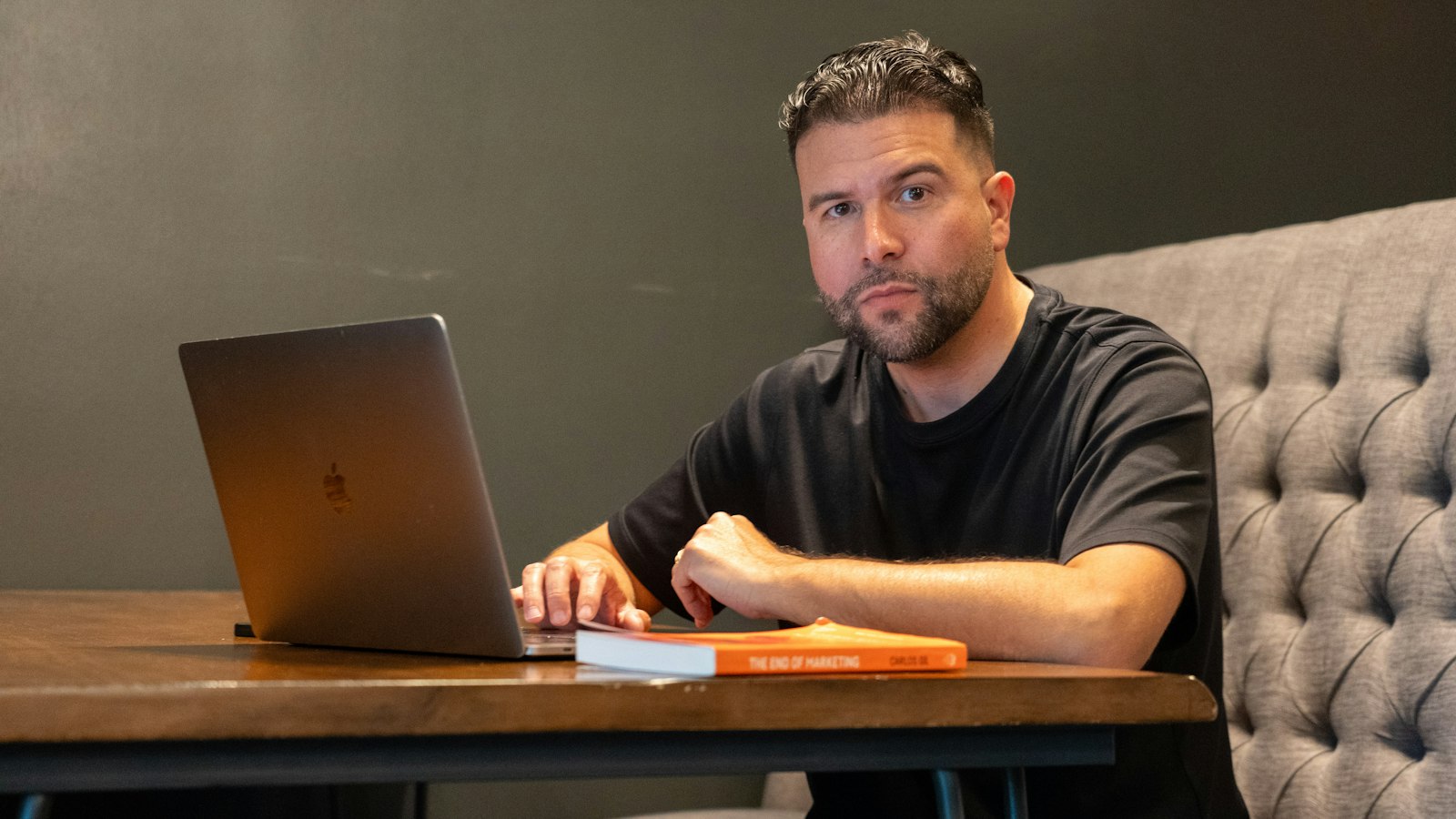 Local business owner comparing local SEO and Google Ads on a laptop